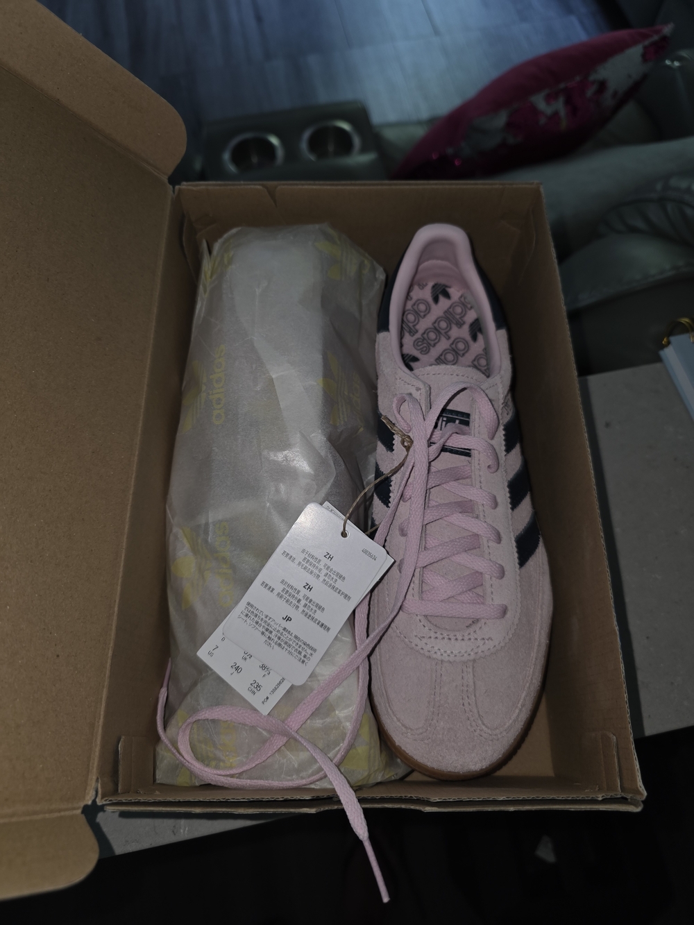 Adidas Handball Spezial Pink Suede Sneakers with Black Stripes.